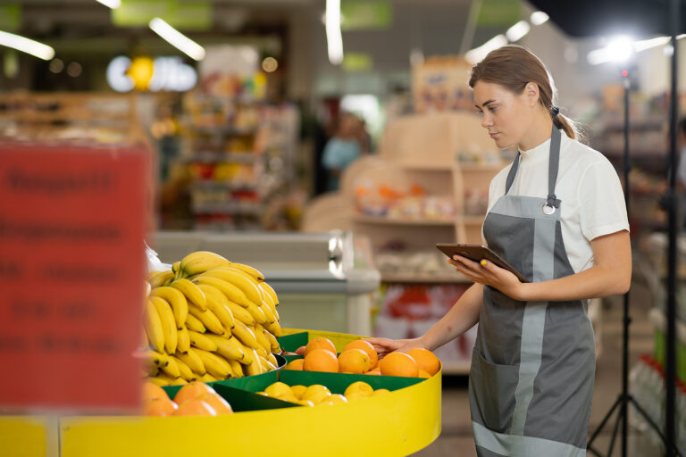 Close Up Portrait Of Caucasian Female Manager Standing In Superm